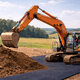 Bagger auf Bodenschutzmatten